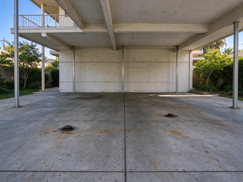 Sewer cleanouts in the carport floor of a Los Angeles apartment building